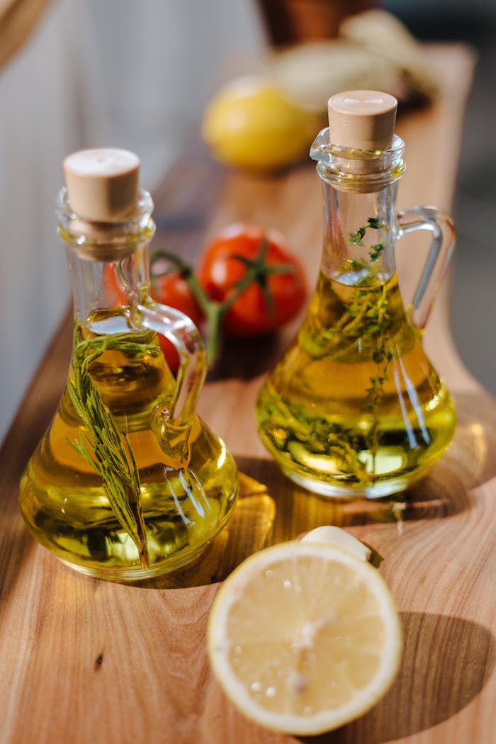 Mastering the First Impression: Your intriguing post title goes here Close-up of herb-infused olive oil with fresh lemon and tomatoes on wooden surface.
